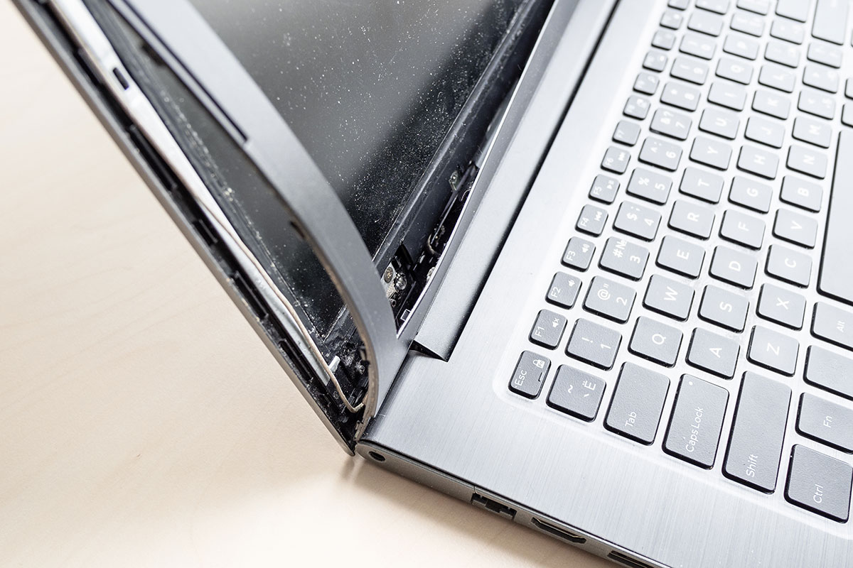 Asus laptop with broken hinge before repair