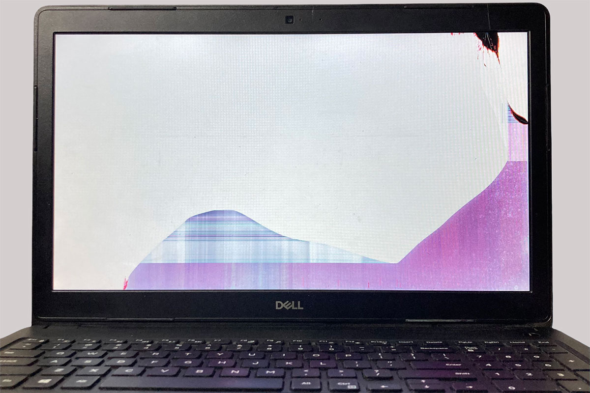 Dell laptop with damaged screen before repair