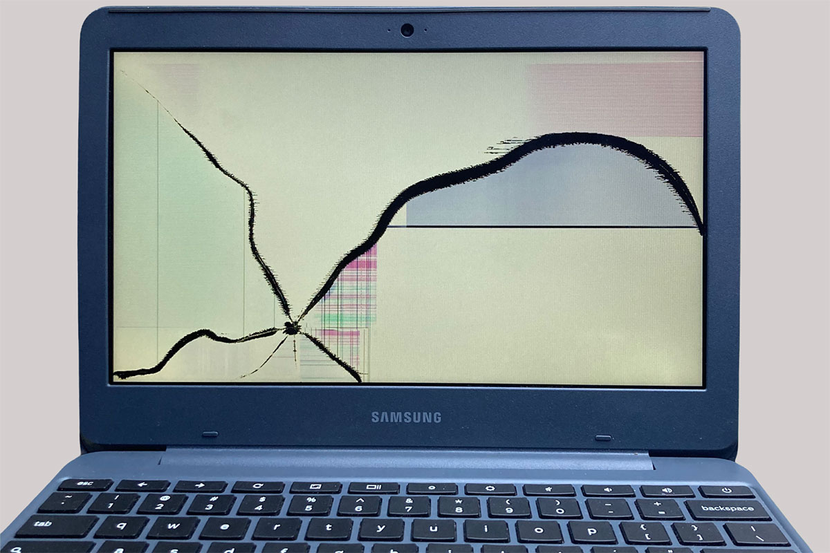 Chromebook with cracked screen before repair