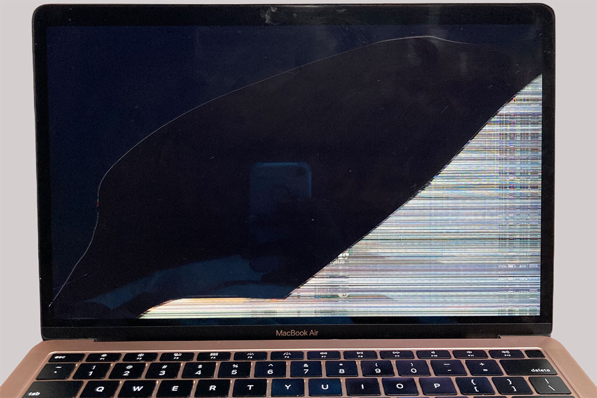 MacBook Pro with damaged screen before repair
